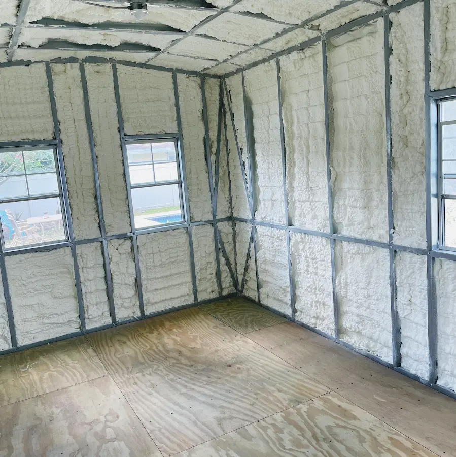 Closed-cell spray foam insulation applied to wall cavities in a residential project in West Dundee